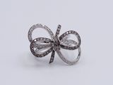 an image of a diamond bow ring on a white background