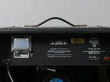 a black amp with a blue light on top of it