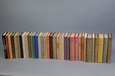 several books are stacked on top of each other on a table