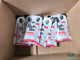 three packages of panda tea sit in a cardboard box on a table