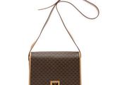 a brown and tan handbag with a brown handle