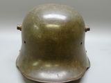a close up of a metal helmet on a table