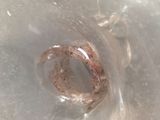 a ring in the middle of a plastic container