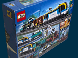 a lego train set in the box on the blue background
