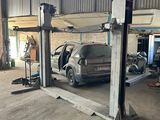 an image of a car being worked on in a garage