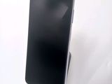 an image of a cell phone sitting on top of a white table