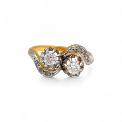 a close up of a diamond ring on a white background