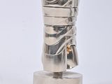 a silver object that is sitting on top of a table