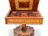 a wooden box with a wooden lid on a stand