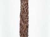 an old wooden pedestal with carvings on top of it on a white background