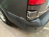 a close up of a car ' s rear end with the door open
