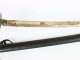 two swords that are laying next to each other on a table