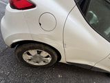 a white car that has been badly damaged by a fire hydrant