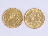 pair of two gold coins with a portrait of a woman and a man on them