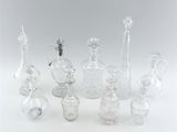 a lot of glass bottles that are sitting on a table