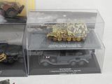 three different models of military vehicles in a display case