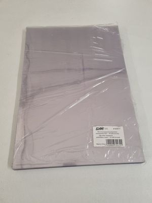 a piece of plastic on a table with a sticker on it