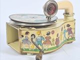 an old fashioned record player with a clock on top of it