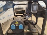 a machine that is sitting on a cart in the dirt