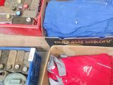 several boxes of assorted items sitting on top of a floor