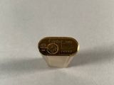 a close up of a gold plated ring on a white surface