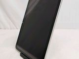 a tablet that is sitting on a stand on a table