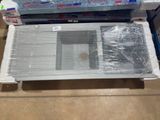 a laptop computer sitting on top of a plastic box