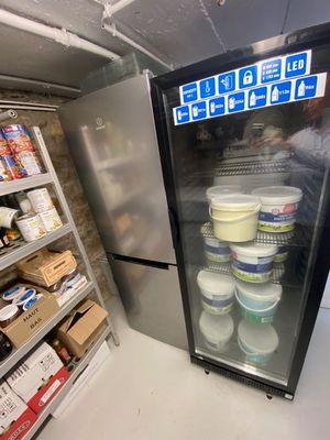 a refrigerator that has a lot of food inside of it