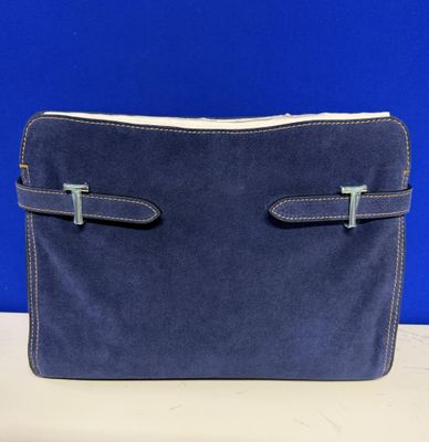 an image of a blue purse sitting on top of a table