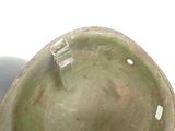 a close up of a helmet on a white surface