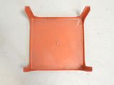 a close up of an orange plastic tray on a white surface