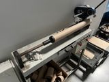 an image of a machine that is making rolls of toilet paper