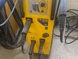 a machine that is sitting on the floor in the garage