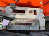 a close up of a car dashboard with a clock on it