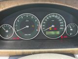 a close up of a car dashboard with various gauges and numbers
