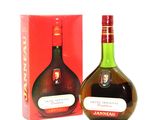 a bottle of liquor that is next to a box