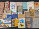 a lot of books that are sitting on a table