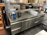 a large kitchen with a lot of dishes on the counter