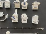 many different types of jewelry on display on the table
