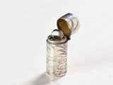 a silver lighter that is sitting on top of a table
