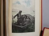 an open book with a picture of a man and a dog in a boat