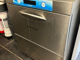an image of a commercial dishwasher in a kitchen