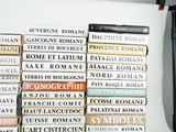 many books stacked on top of each other on a table
