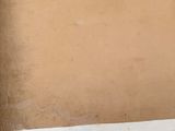 a cardboard box with a drawing of a penguin on it