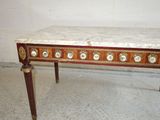 an image of a marble topped table with a wooden base