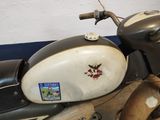 a motorcycle with a skull and crossbone sticker on it