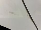 a close up of a car ' s hood with rust on it