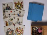 a box of playing cards sitting next to a box of playing cards