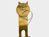 brass sculpture of a cat with a ring in its mouth