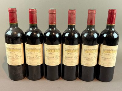 six bottles of wine are lined up in a row on a table